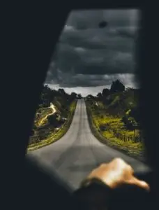 Highway Near Trees Under Cloudy Sky